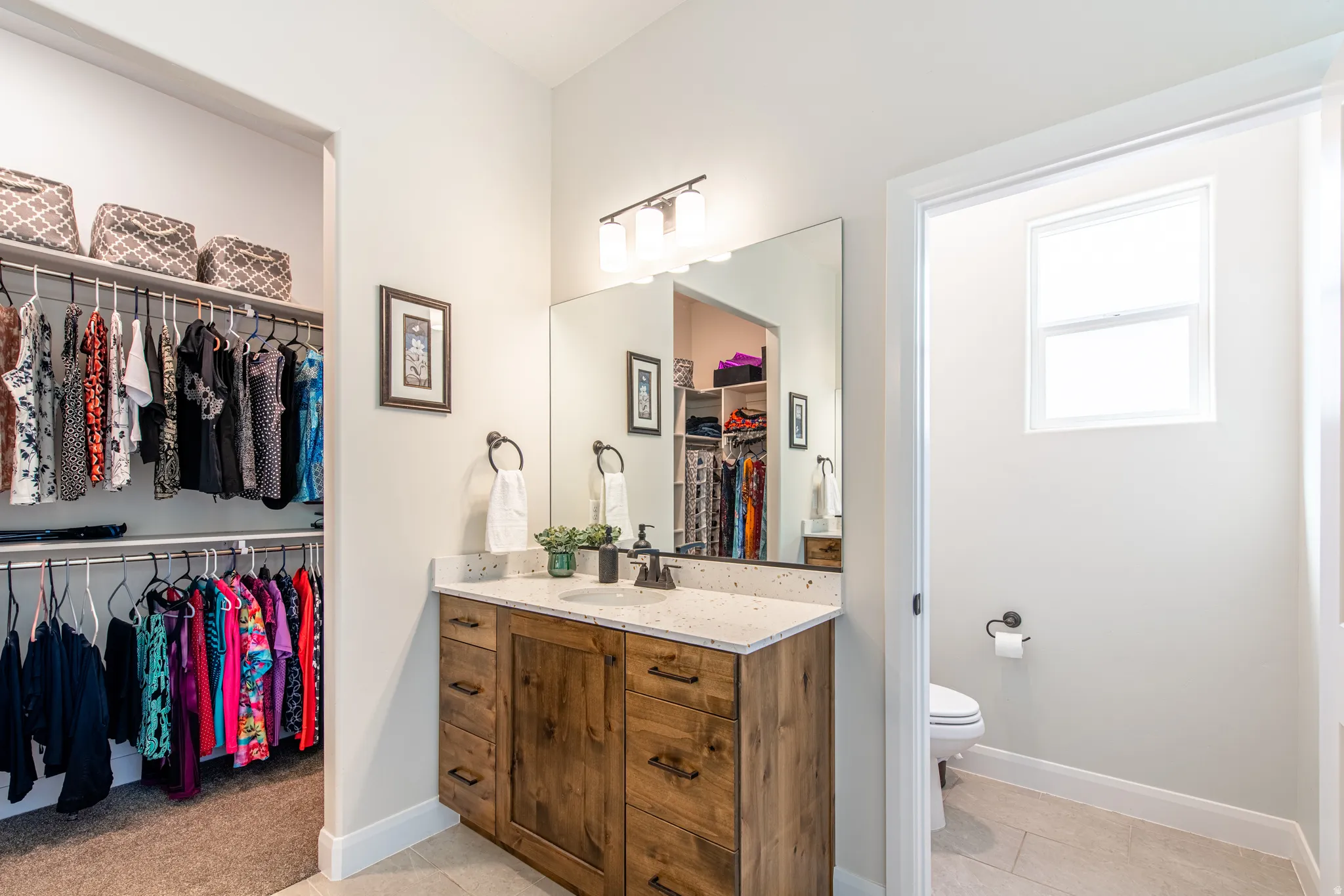 Walk-in closet with built-in shelving and hanging rods