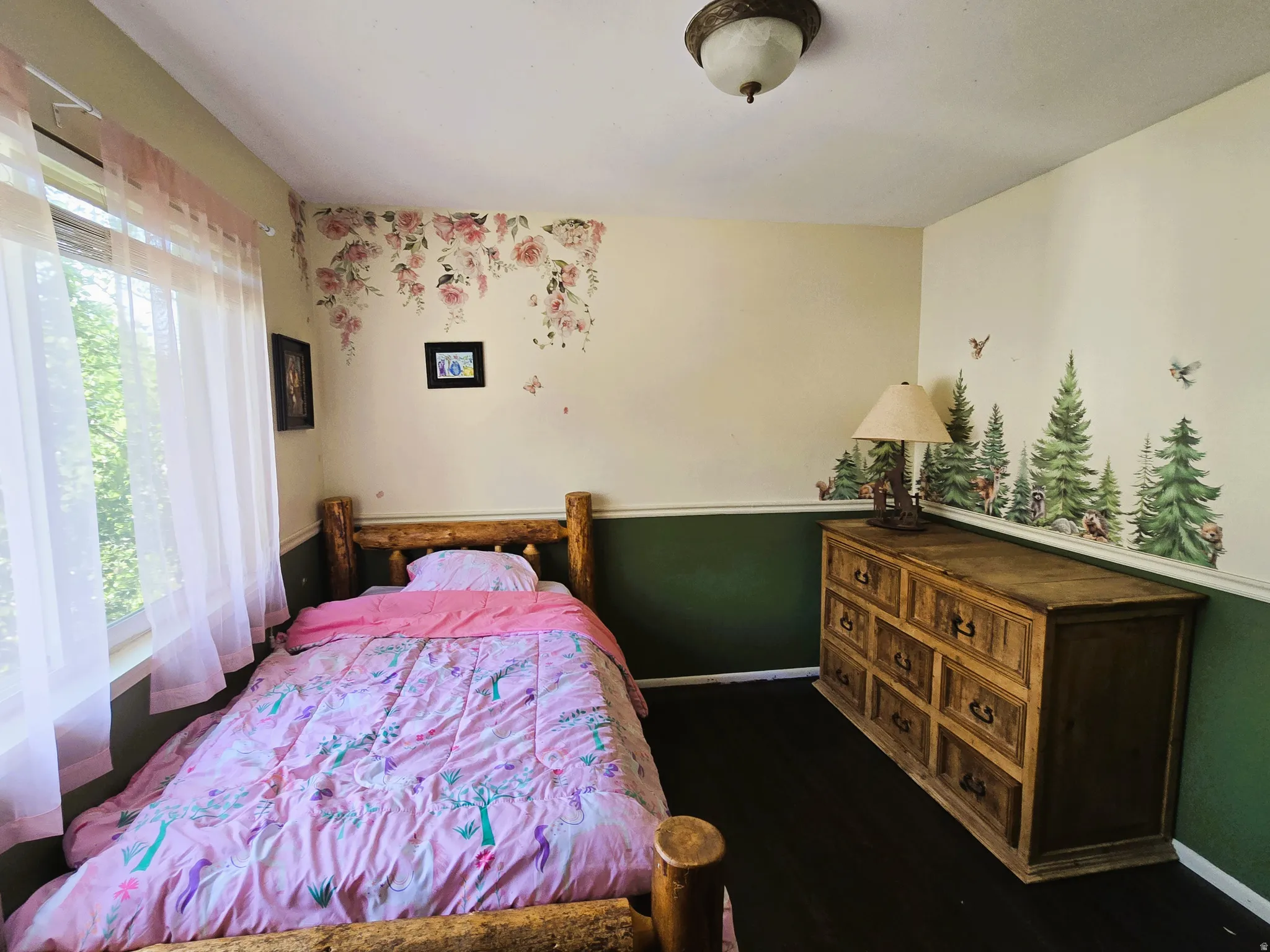 Recessed window with sheer curtains, wood-finish flooring, and a semi-flush mount ceiling light fixture