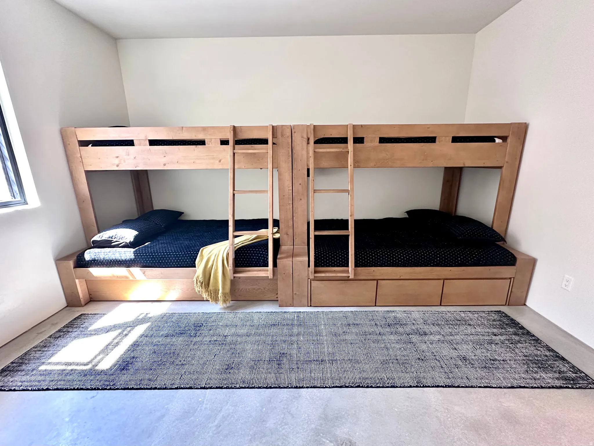 Built-in wood bunk beds with integrated storage drawers