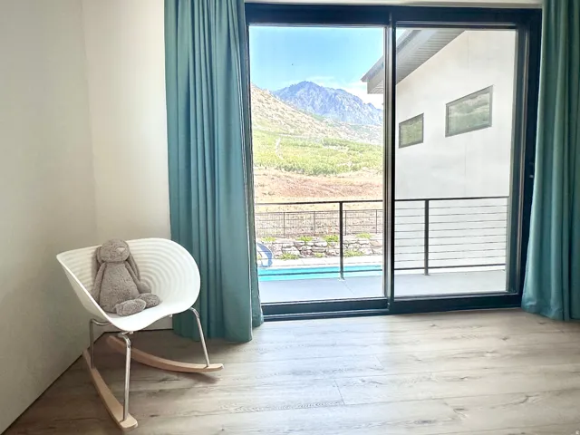 Sliding glass doors opening to an exterior balcony