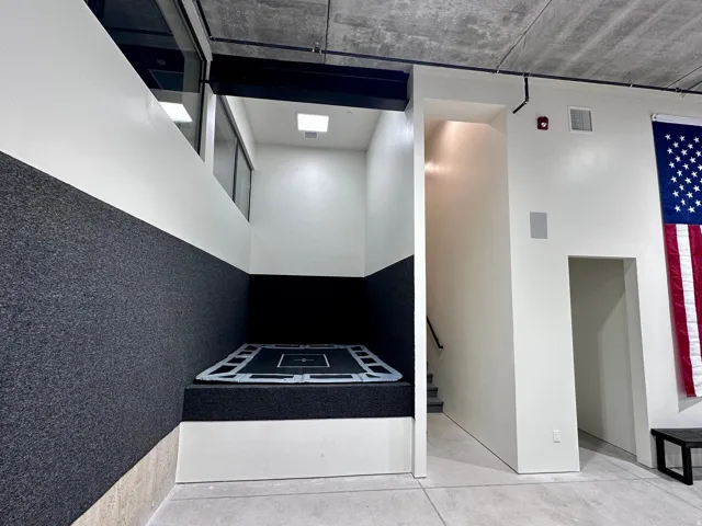 Recessed trampoline area with carpeted walls and integrated lighting