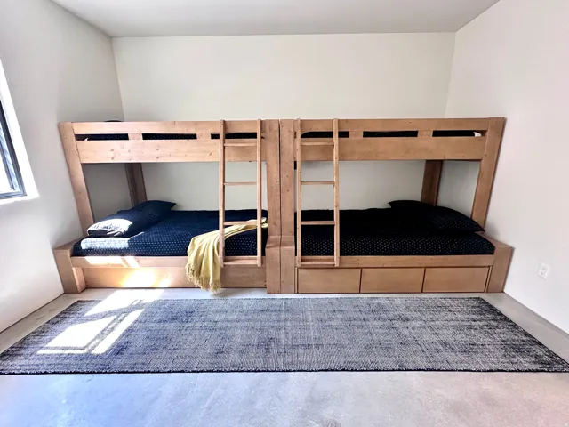 Built-in wood bunk beds with integrated storage drawers