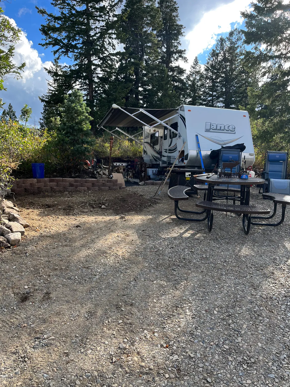 Gravel ground cover and a stone retaining wall