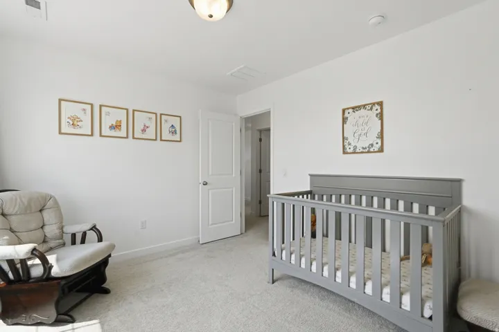 Recessed lighting with a semi-flush mount fixture, light-toned wall-to-wall carpeting, and white painted walls