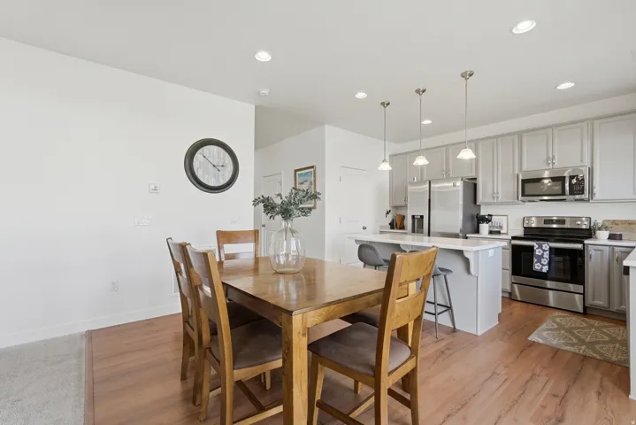 Hardwood-finish flooring throughout, complemented by recessed lighting and pendant lighting