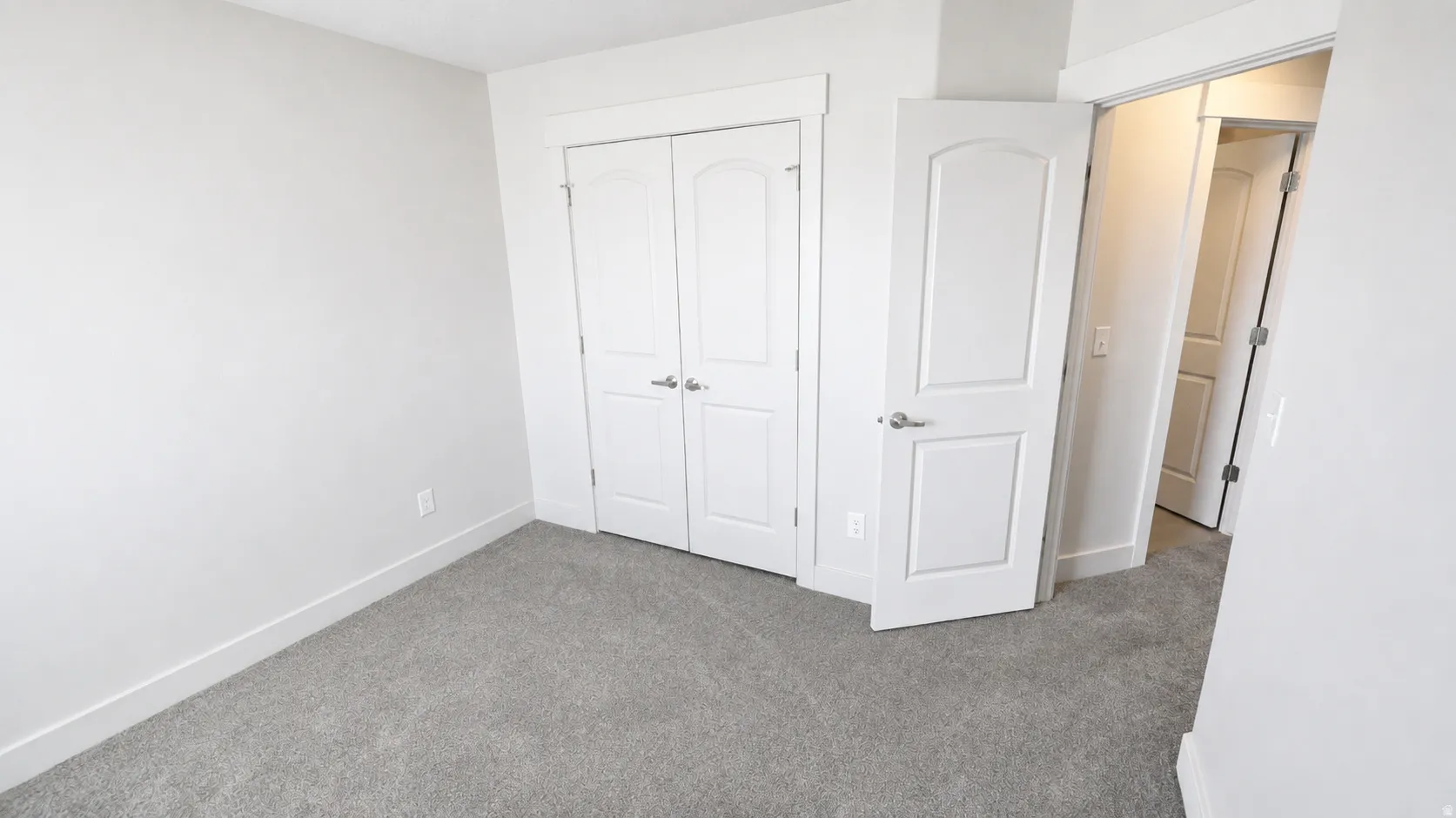 Neutral-toned carpeting throughout