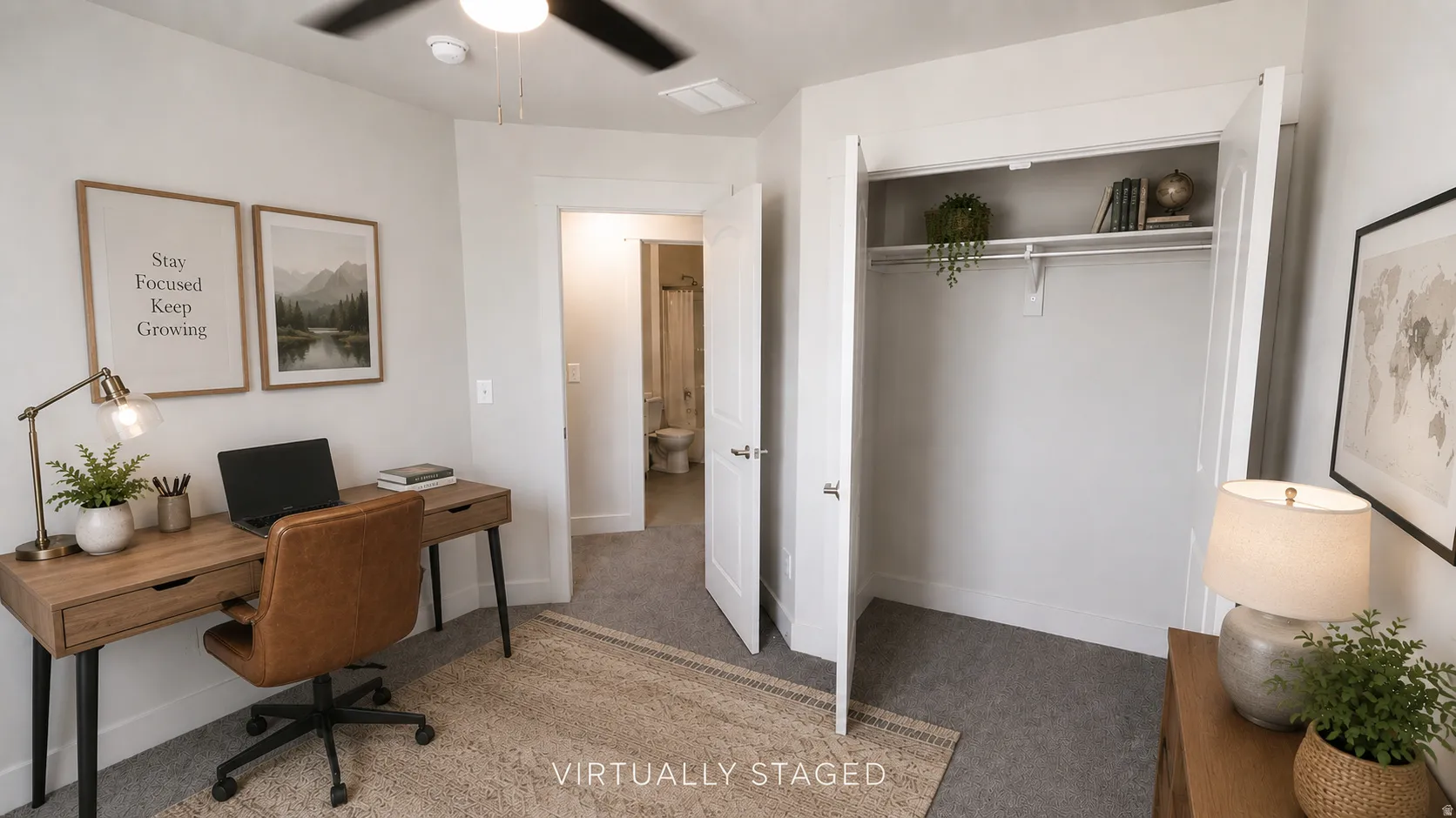 Built-in closet with shelving, ceiling fan, and carpeted flooring