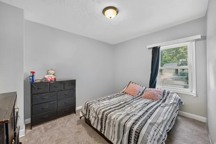 Neutral-toned wall paint with a window offering natural light