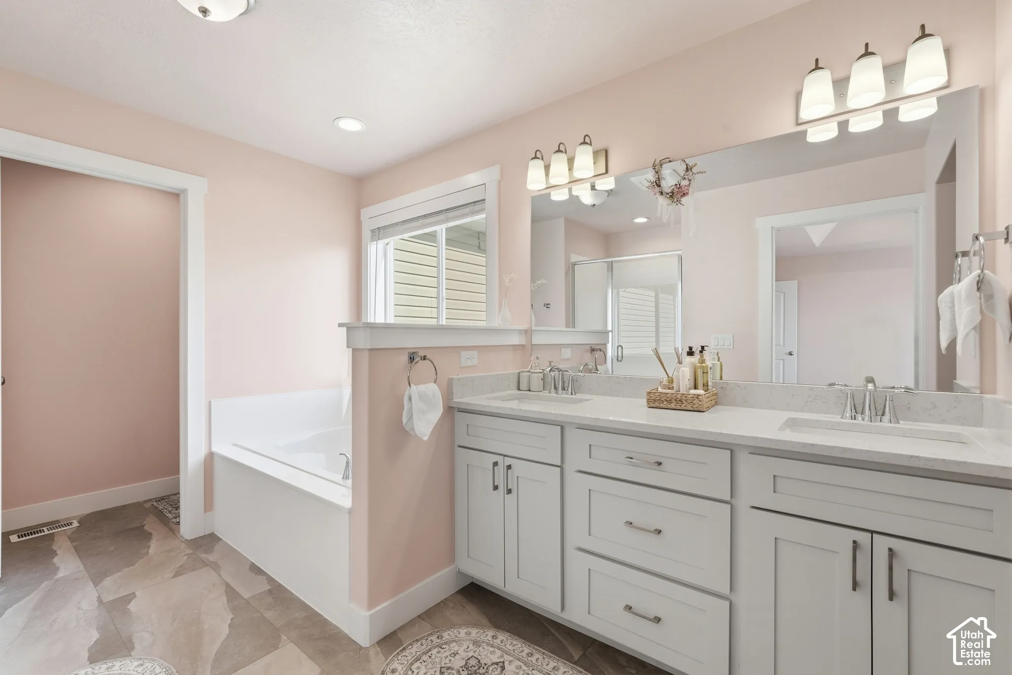 Dual vanity with integrated sinks and brushed nickel fixtures