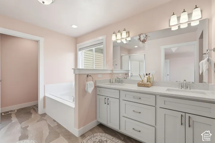 Dual vanity with integrated sinks and brushed nickel fixtures