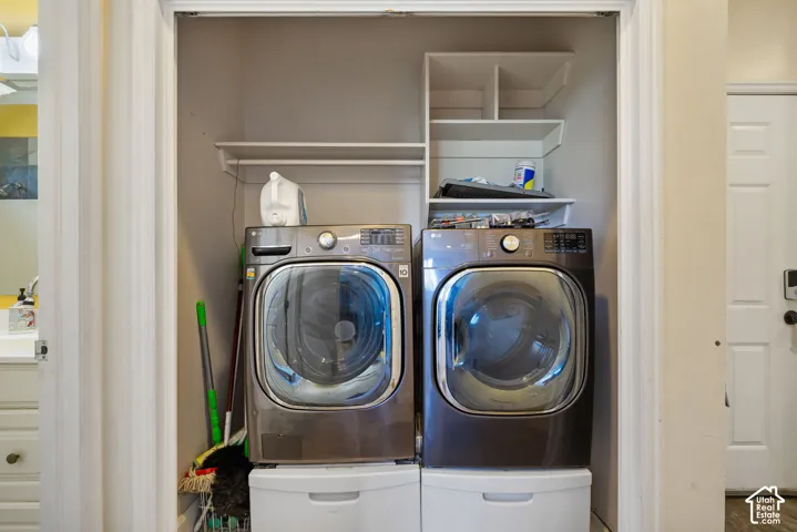 Laundry closet featuring built-in shelving
