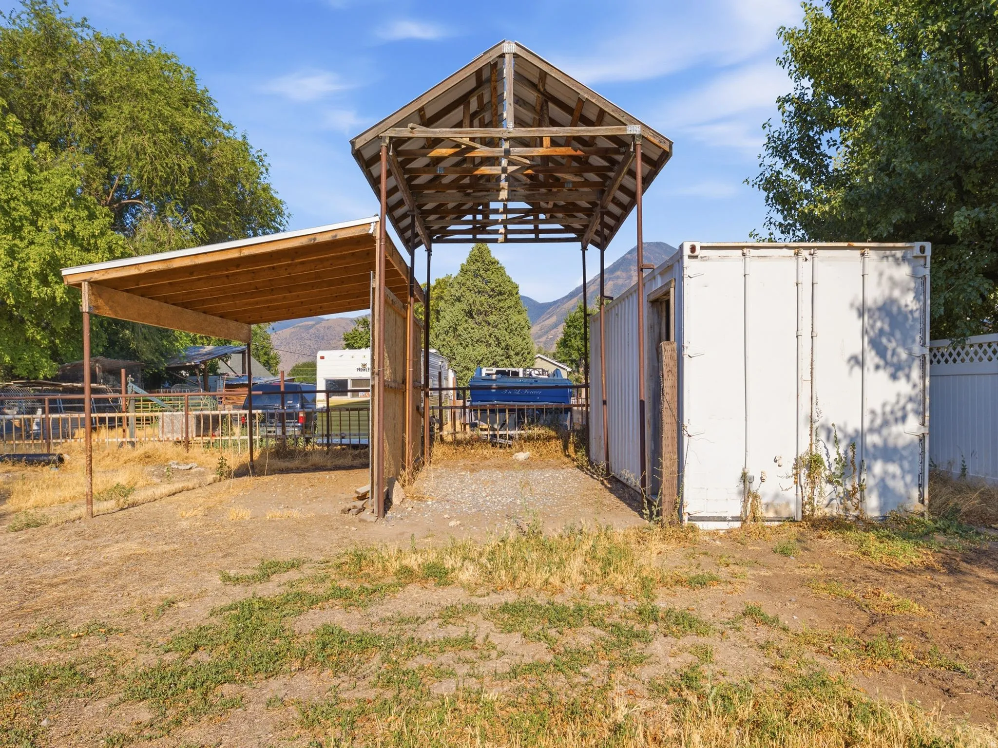 Hay barn, horse stall, and Connex storage container.