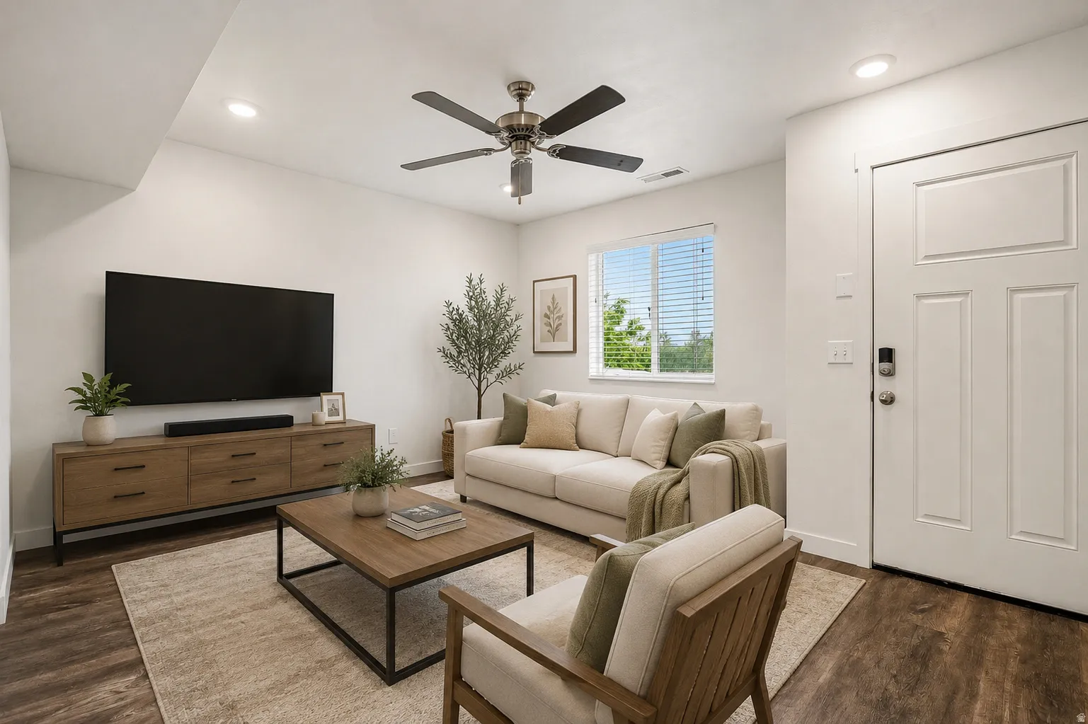 Living area featuring wood-finish flooring, recessed lighting, and a ceiling fan