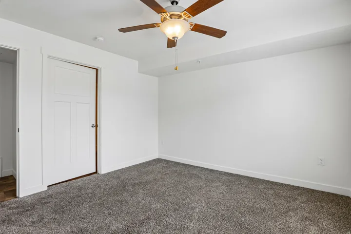 Interior room featuring neutral wall finishes and gray carpeting