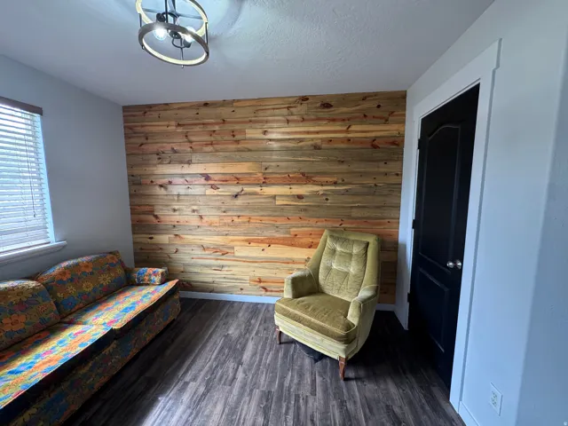 Wood-finish flooring with a horizontal wood-paneled accent wall