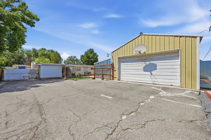 Metal-sided outbuilding with an overhead door