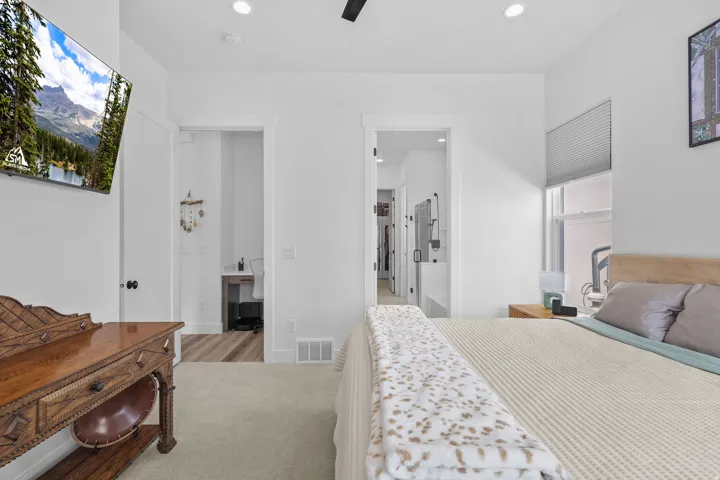 Recessed lighting, ceiling fan, carpeted flooring, and a window with blinds