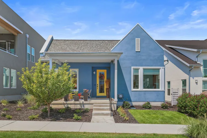 Blue stucco exterior with white trim