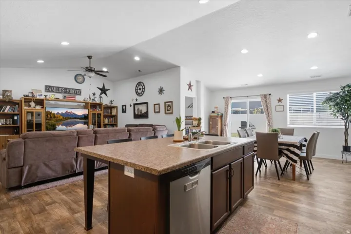 Open-concept living area with wood-finish flooring throughout