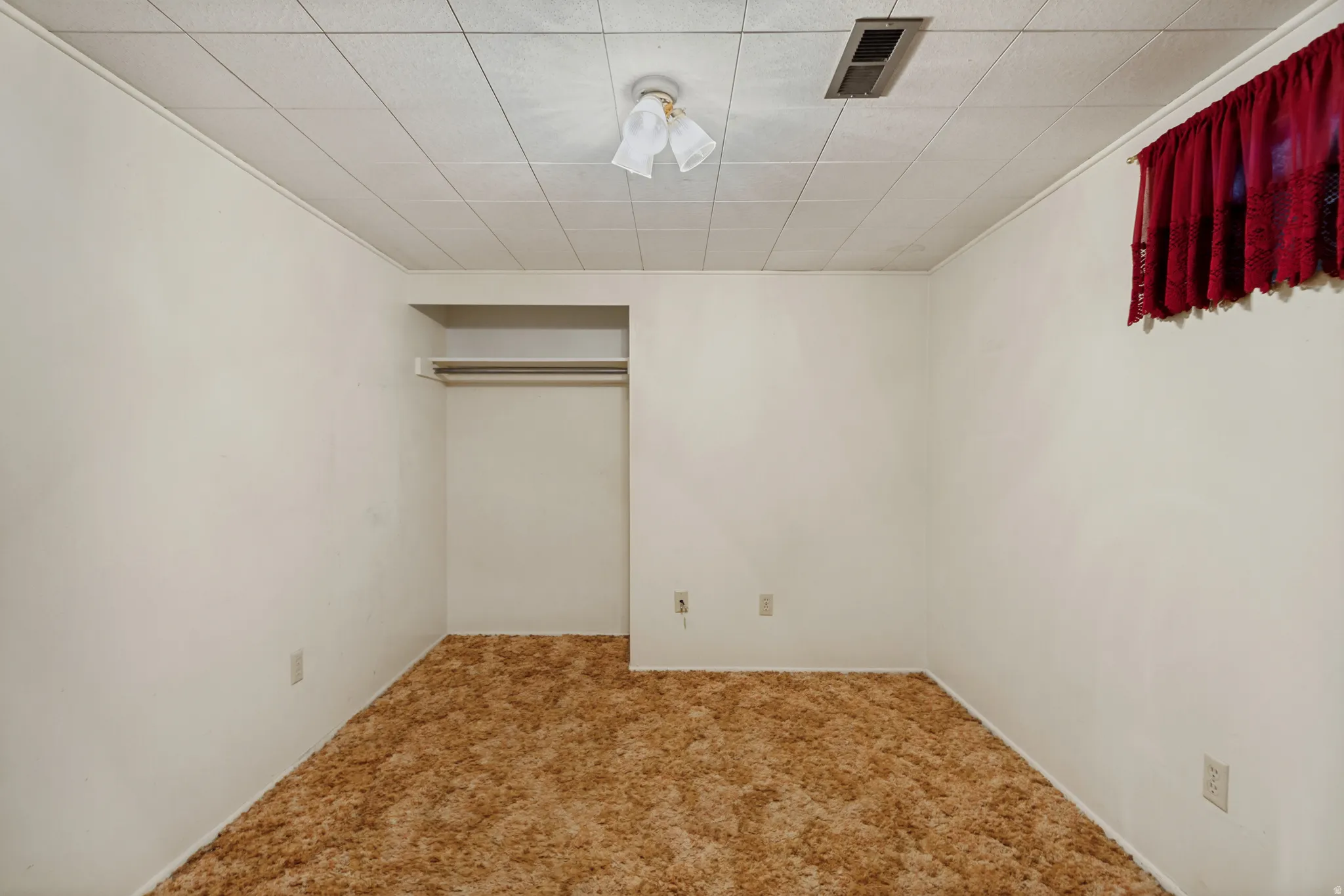 Recessed closet with a built-in shelf and hanging rod