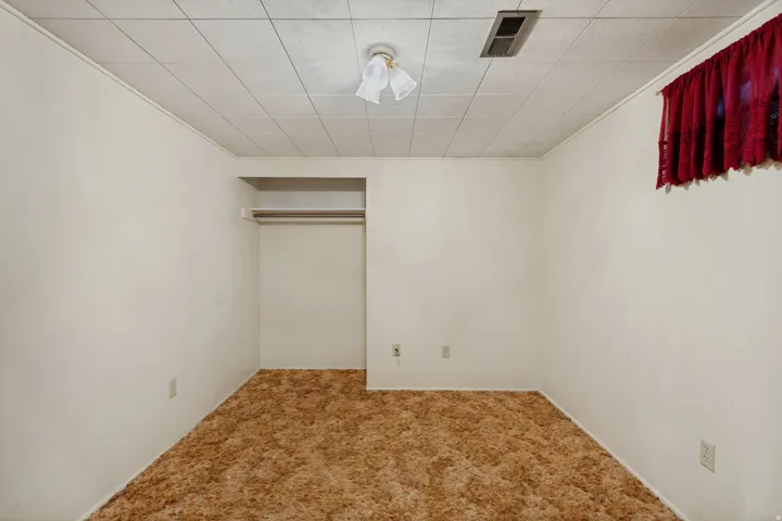 Recessed closet with a built-in shelf and hanging rod