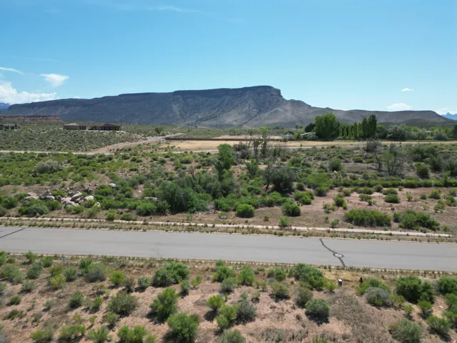 Expansive mountain backdrop with scattered residential structures