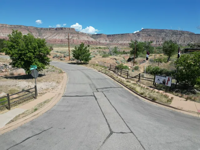 Paved road with adjacent curb and sidewalk