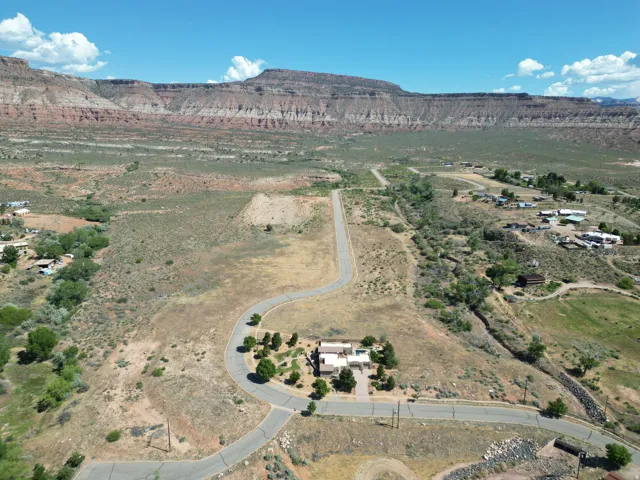 Property situated on a paved cul-de-sac with surrounding desert landscaping, offering extensive mountain scenery