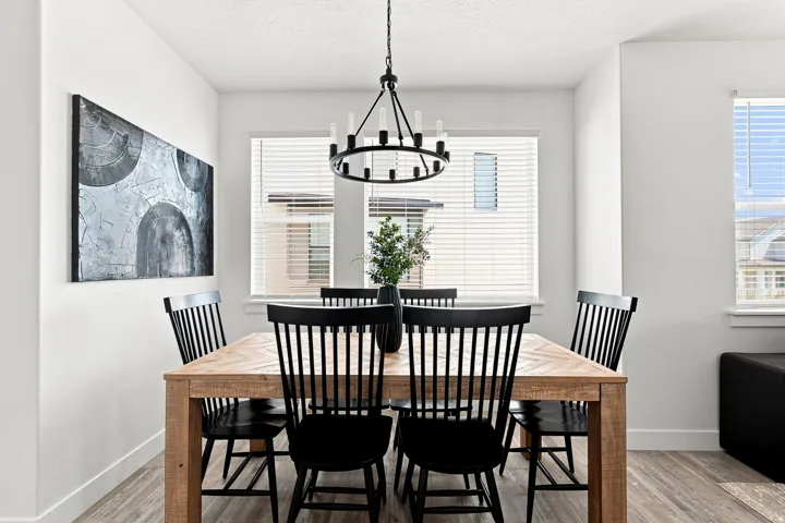 Recessed wall with large window, a second window, and a linear chandelier