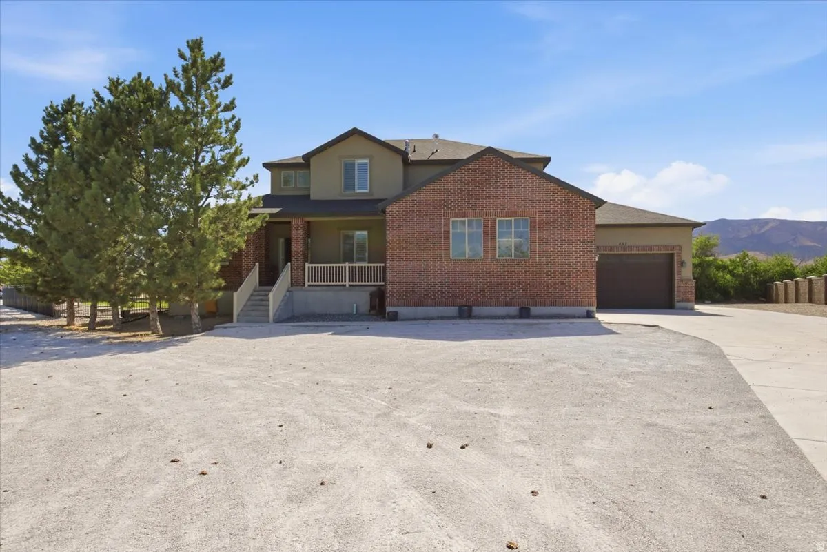 Two-story residence featuring brick and stucco siding