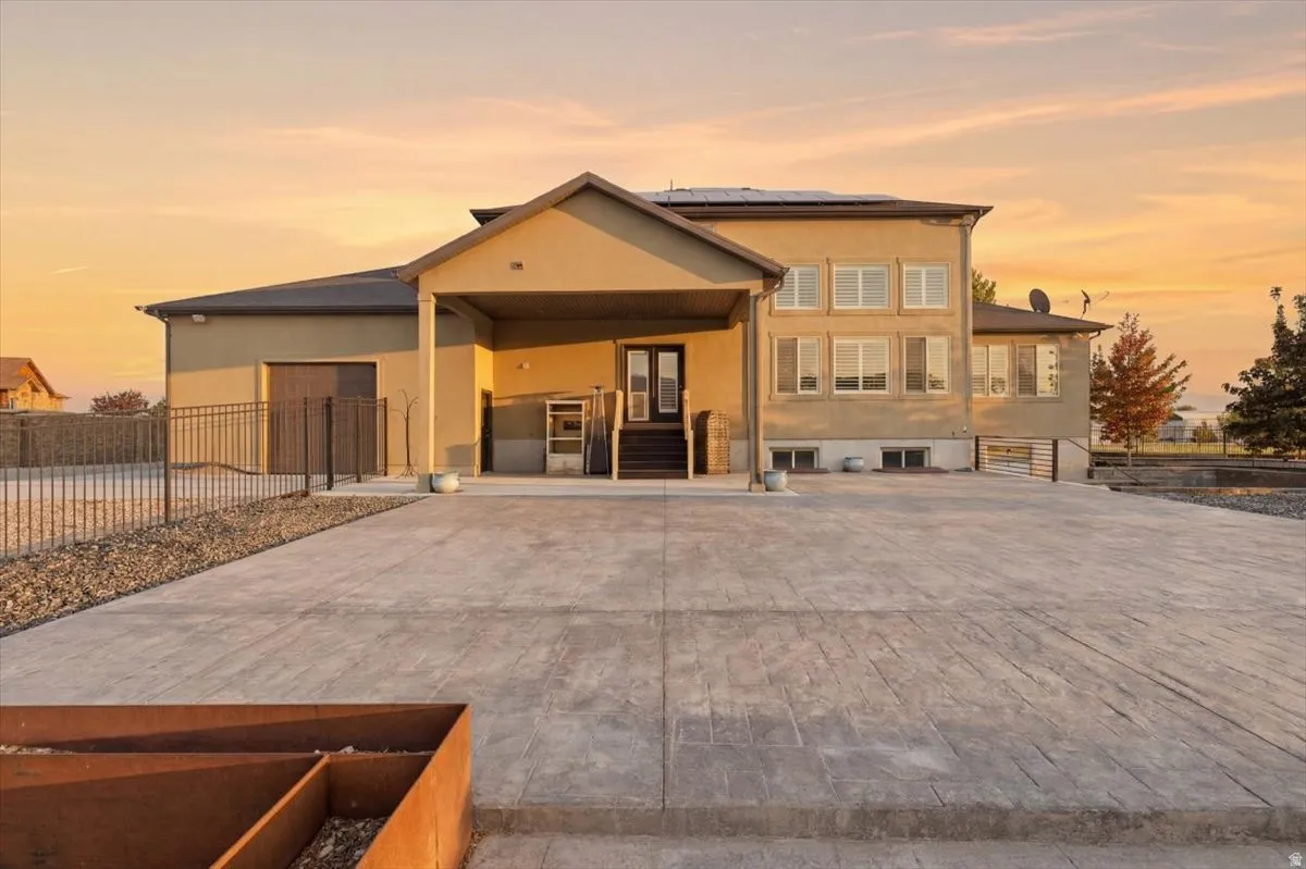 Expansive stamped concrete patio with direct access to the covered entry