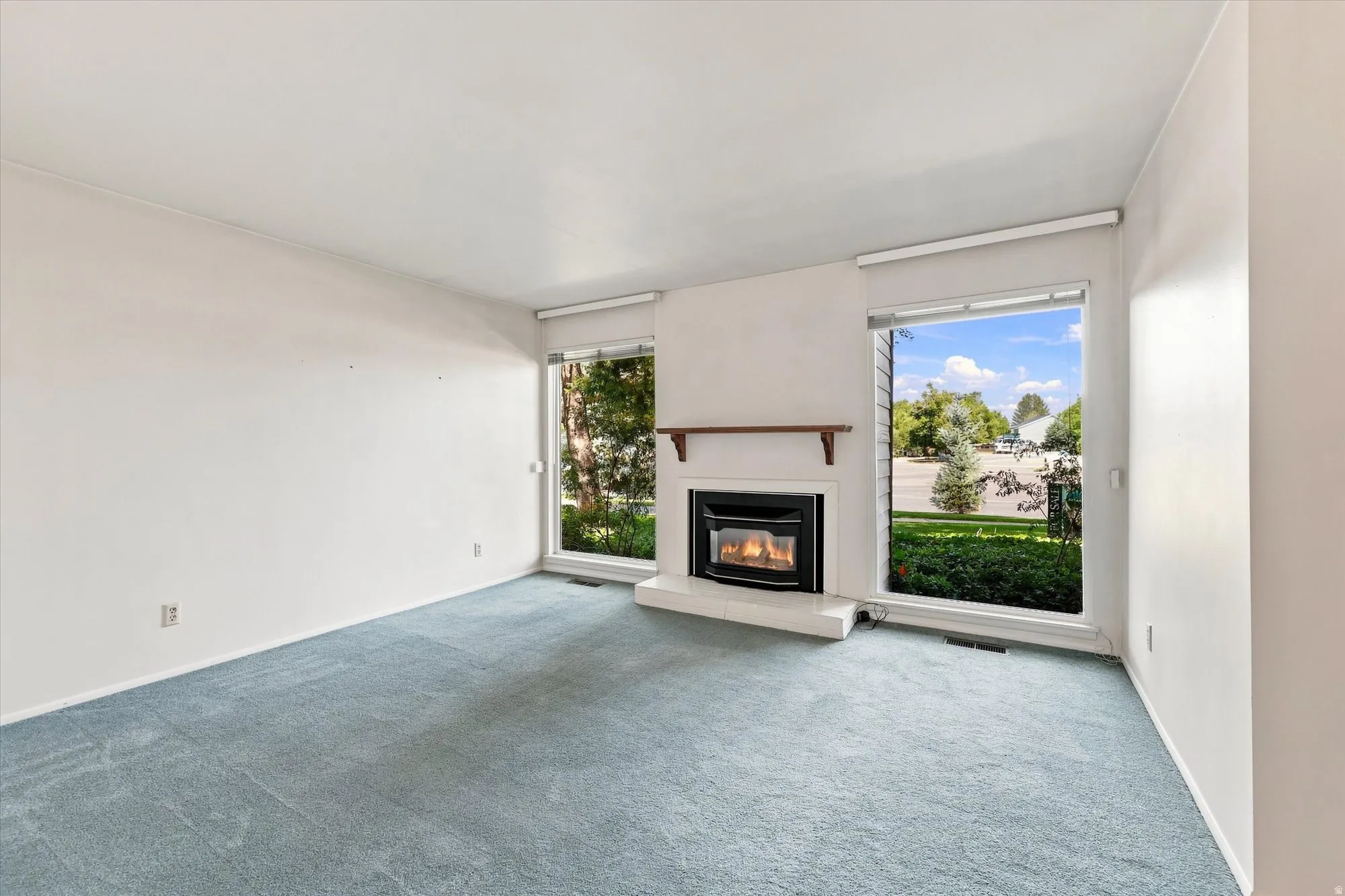 White walls paired with light blue carpeting