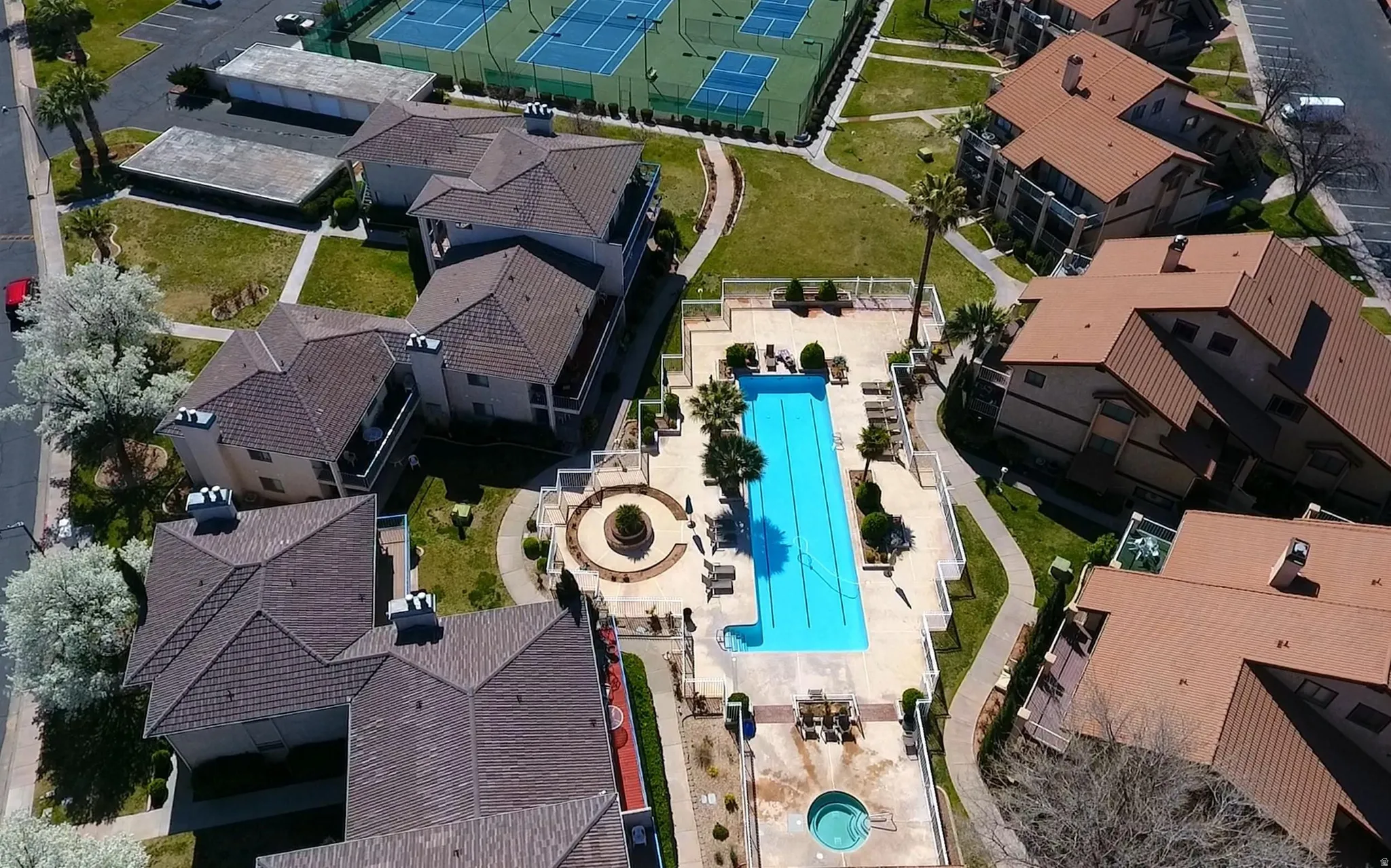 Community features an outdoor pool, separate spa, and tennis courts