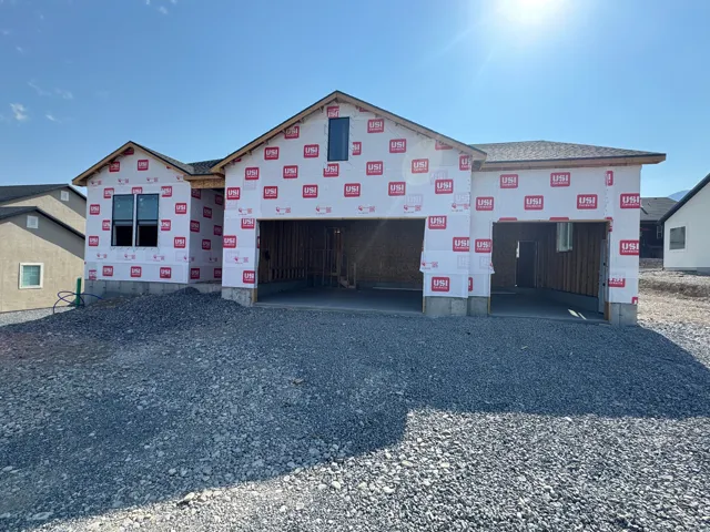 Gabled rooflines and a three-car garage