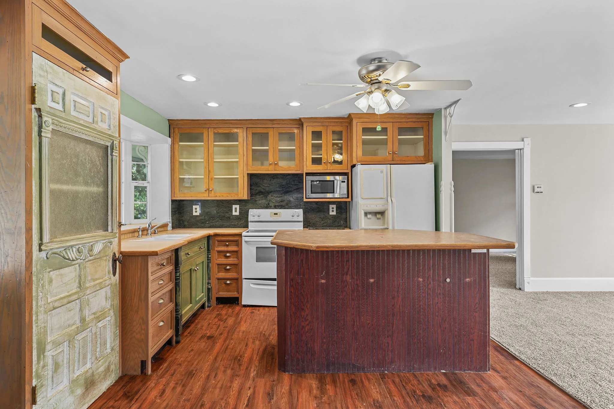 Wood-finish flooring throughout the kitchen area