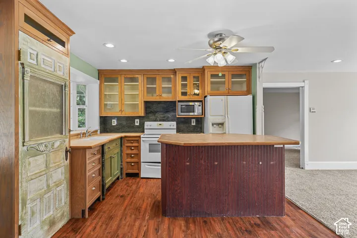 Wood-finish flooring throughout the kitchen area