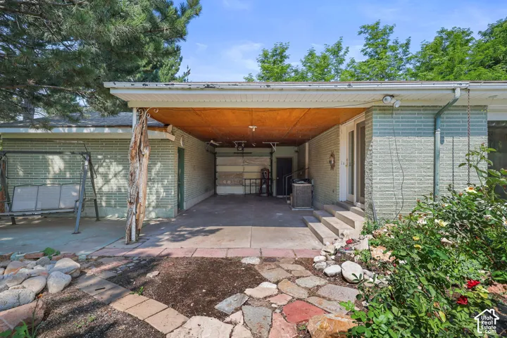 Covered carport with wood-finish ceiling