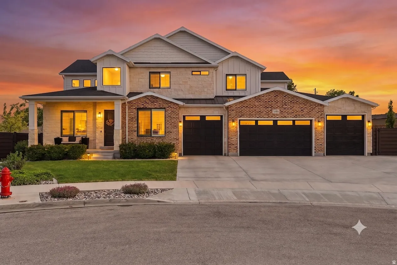 Multi-level exterior featuring stone and brick accents