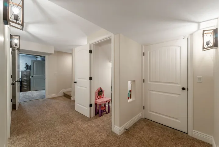 Play Area Under Stairs, Storage, and Entrance to Basement Apartment.