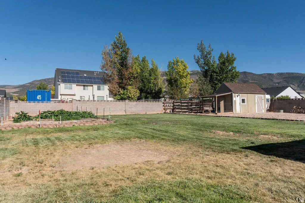 Spacious rural property featuring a multi-structure layout with a primary residence, detached outbuildings, and expansive grounds