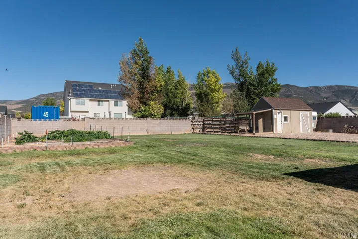 Spacious rural property featuring a multi-structure layout with a primary residence, detached outbuildings, and expansive grounds