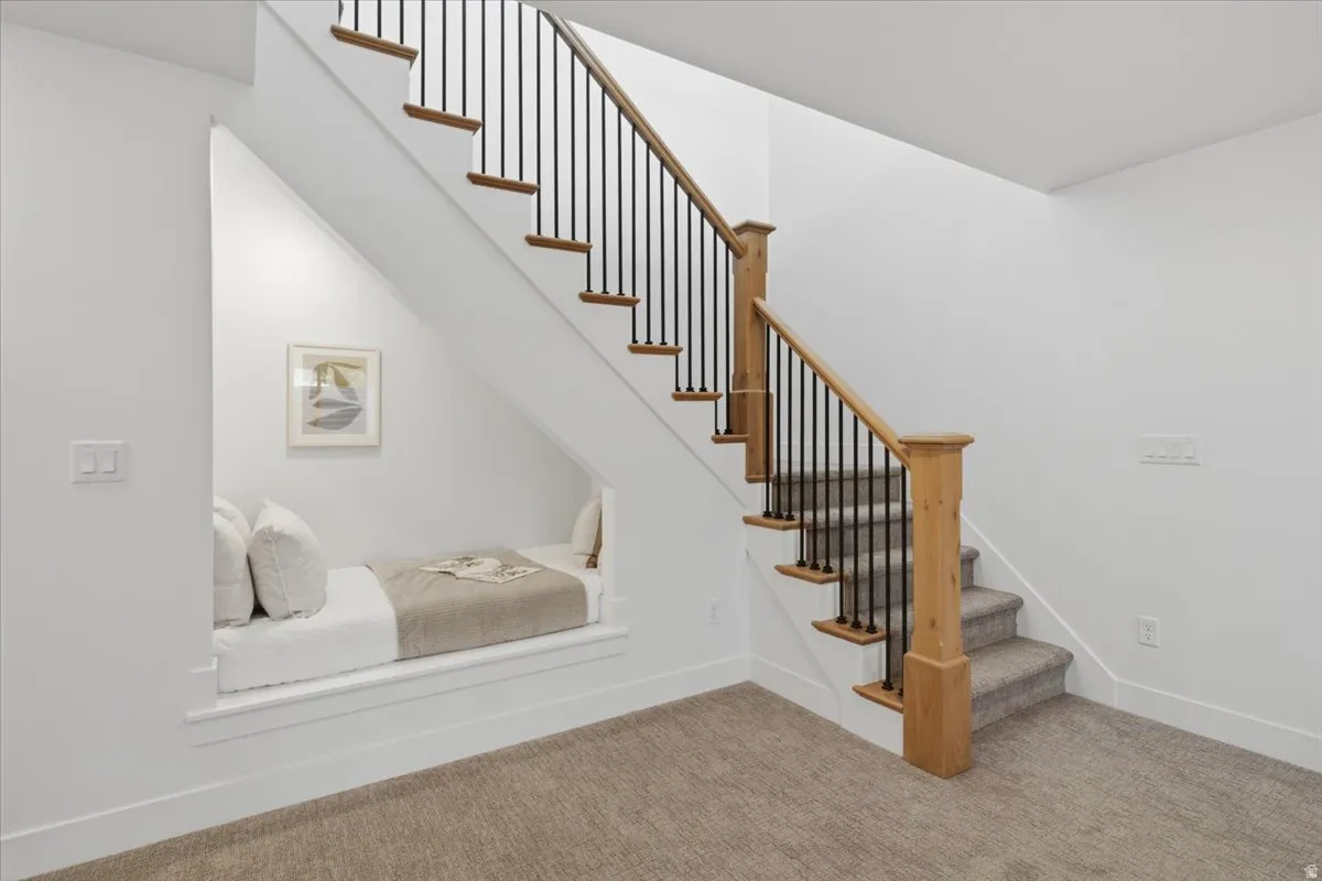 Built-in under-stair seating nook with recessed lighting