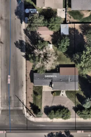 Aerial Property Survey. Overhead documentation of the property showing structures, landscape features, and site boundaries with parcel identification number