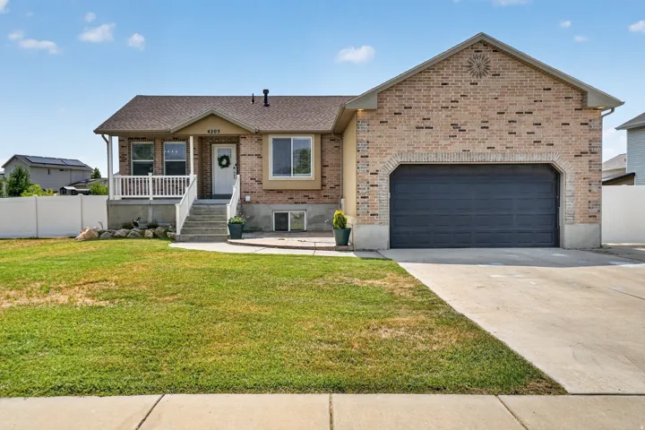 Brick facade with a prominent two-car garage