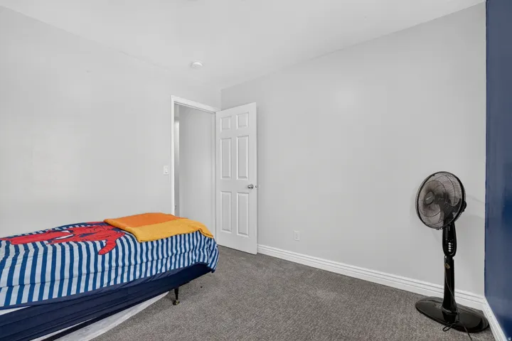 Gray wall paint, white trim, and a white paneled door