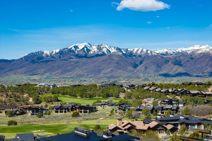 Expansive mountain range backdrop with snow-capped peaks