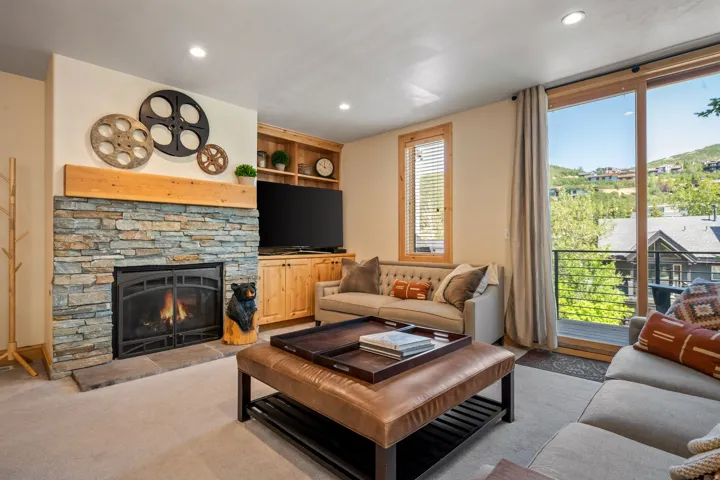Stone-faced fireplace with a wood mantel