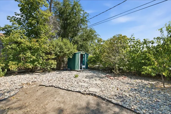 Spacious grounds with mature landscaping and established trees providing natural privacy and shade