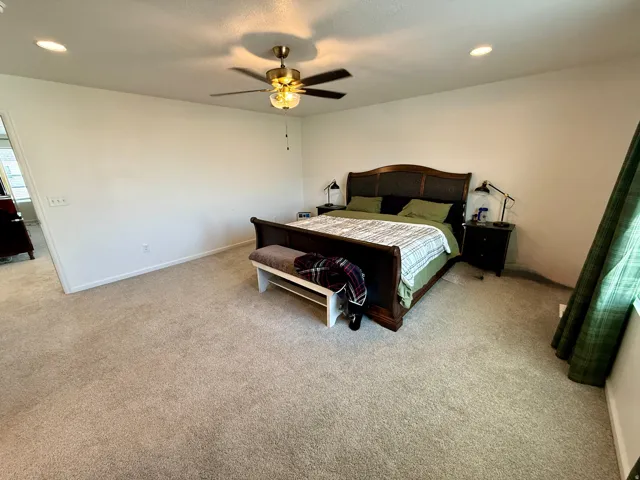 Master bedroomsCarpeted room featuring a ceiling fan with integrated lighting and recessed lighting fixtures