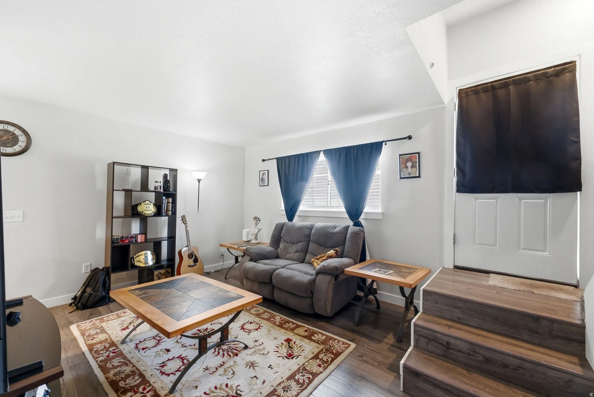 Wood-finish flooring throughout the room